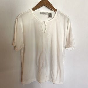 Carolyn Taylor white tee with flower embroidery and clasp front.